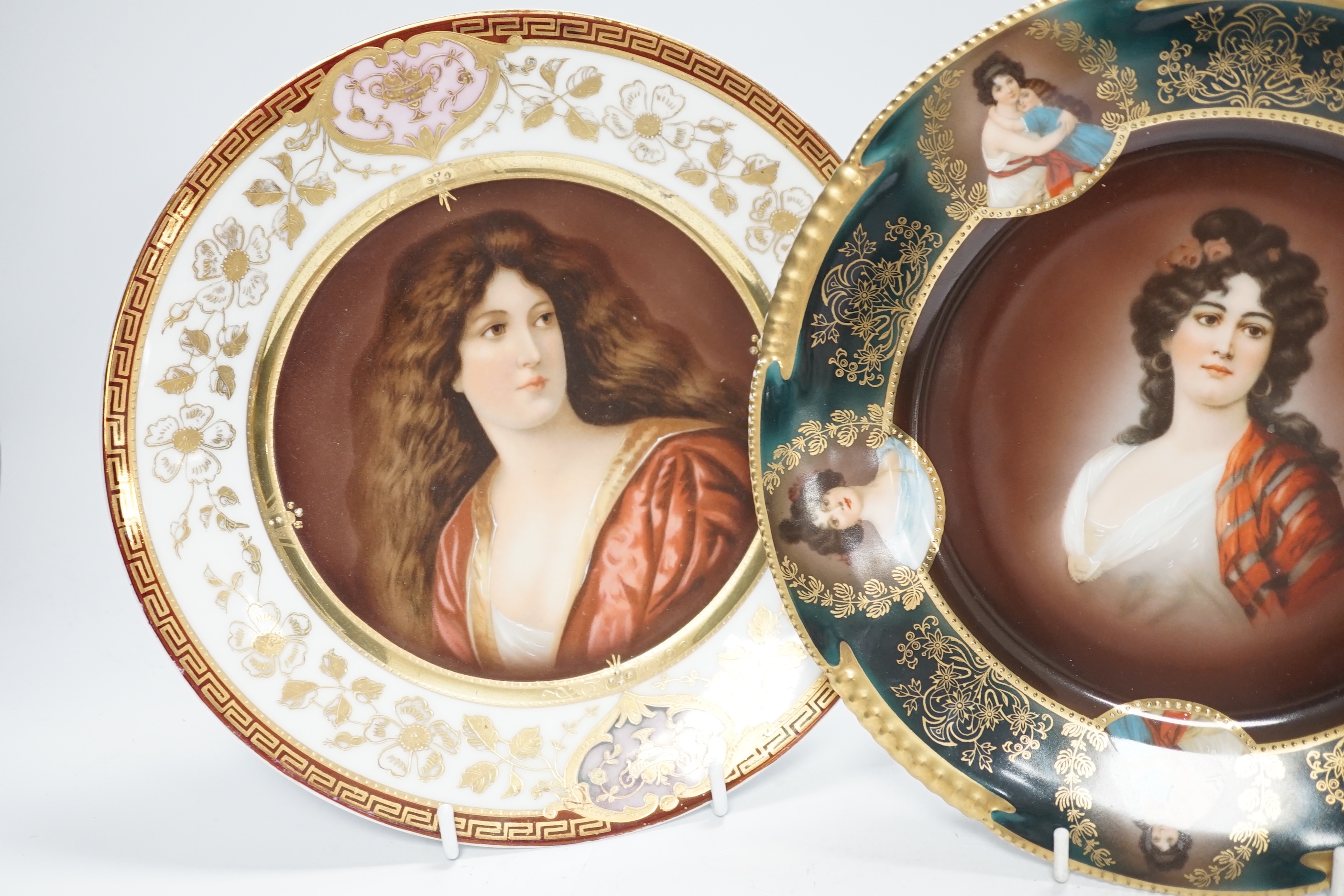 Two early 20th century Vienna style cabinet plates, printed and enamelled with portraits, 24cm diameter